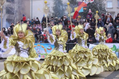 Pernik, Bulgaria - January 28, 2023: International masquerade festival Surva in Pernik, Bulgaria. People with mask called Kukeri dance and perform to scare the evil spirits.