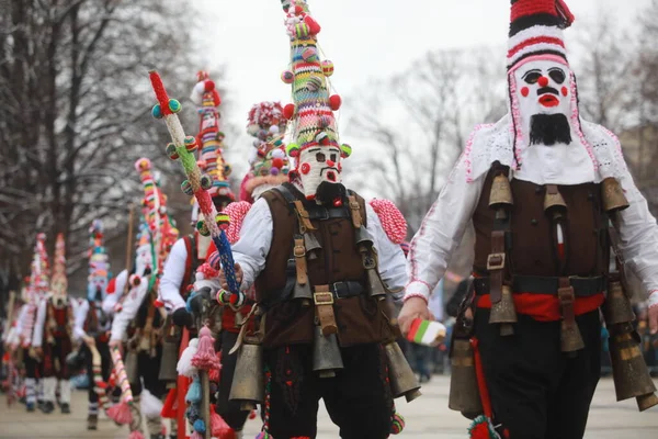 Pernik, Bulgaria - January 28, 2023: International masquerade festival Surva in Pernik, Bulgaria. People with mask called Kukeri dance and perform to scare the evil spirits.