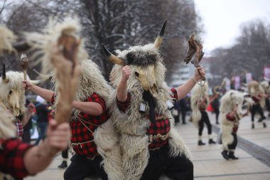 Pernik, Bulgaria - January 28, 2023: International masquerade festival Surva in Pernik, Bulgaria. People with mask called Kukeri dance and perform to scare the evil spirits.
