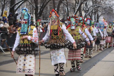 Pernik, Bulgaria - January 28, 2023: International masquerade festival Surva in Pernik, Bulgaria. People with mask called Kukeri dance and perform to scare the evil spirits.