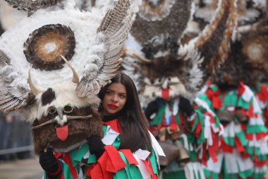 Pernik, Bulgaria - January 28, 2023: International masquerade festival Surva in Pernik, Bulgaria. People with mask called Kukeri dance and perform to scare the evil spirits.