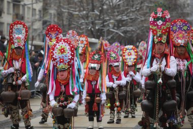 Pernik, Bulgaria - January 28, 2023: International masquerade festival Surva in Pernik, Bulgaria. People with mask called Kukeri dance and perform to scare the evil spirits.