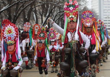 Pernik, Bulgaria - January 28, 2023: International masquerade festival Surva in Pernik, Bulgaria. People with mask called Kukeri dance and perform to scare the evil spirits.