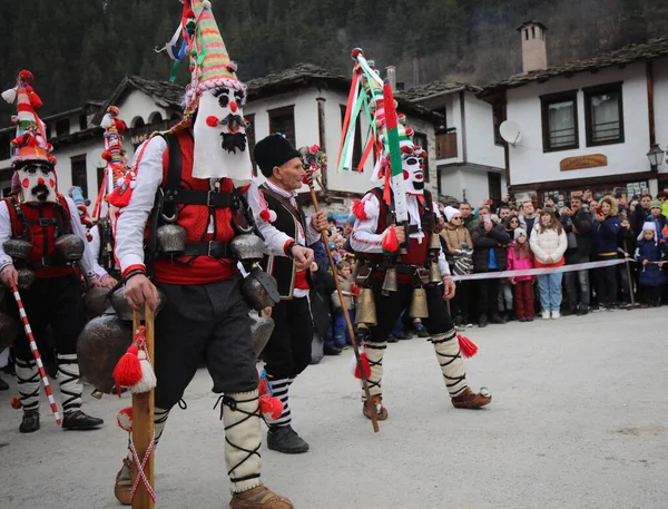 Stock image Shiroka laka, Bulgaria - March 5, 2023: People with mask called Kukeri dance and perform to scare the evil spirits at the Festival of the Masquerade Games 