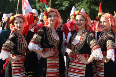 Sofia, Bulgaria - July 17, 2024: Festive procession through the streets of Sofia of participants in the Vitosha International Folklore Festival clipart