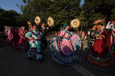 Sofia, Bulgaria - July 17, 2024: Festive procession through the streets of Sofia of participants in the Vitosha International Folklore Festival clipart