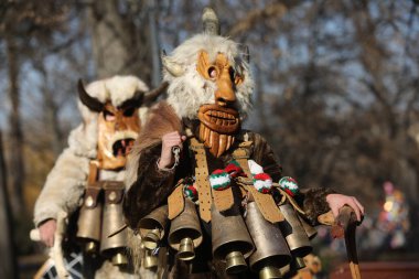 Sofia, Bulgaria - January 05, 2025: The Surva masquerade games festival in Sofia, Bulgaria. People called Kukeri parade in masks and ritual costumes, perform ritual dances to drive away evil spirits in Sofia, Bulgaria clipart