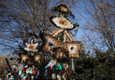 Sofia, Bulgaria - January 05, 2025: The Surva masquerade games festival in Sofia, Bulgaria. People called Kukeri parade in masks and ritual costumes, perform ritual dances to drive away evil spirits in Sofia, Bulgaria clipart