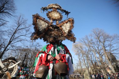 Sofia, Bulgaria - January 05, 2025: The Surva masquerade games festival in Sofia, Bulgaria. People called Kukeri parade in masks and ritual costumes, perform ritual dances to drive away evil spirits in Sofia, Bulgaria clipart