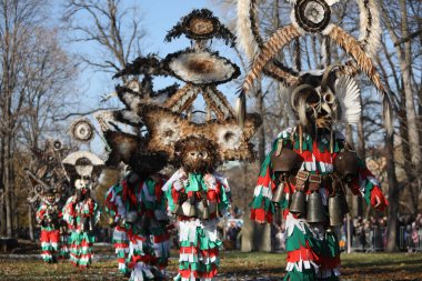 Sofia, Bulgaria - January 05, 2025: The Surva masquerade games festival in Sofia, Bulgaria. People called Kukeri parade in masks and ritual costumes, perform ritual dances to drive away evil spirits in Sofia, Bulgaria clipart