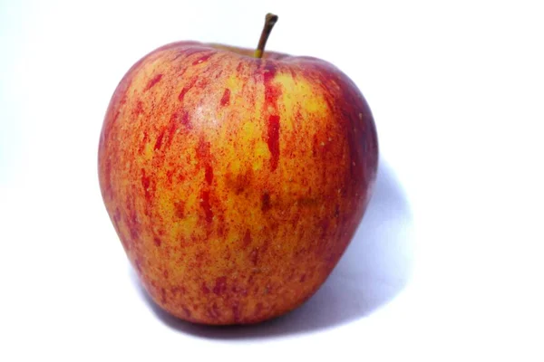 red apples on a white background isolated on the right of it.