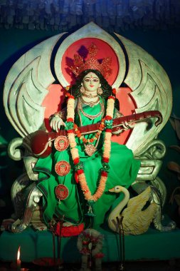 Saraswati Devi. Hindu goddess Saraswati idol. clipart