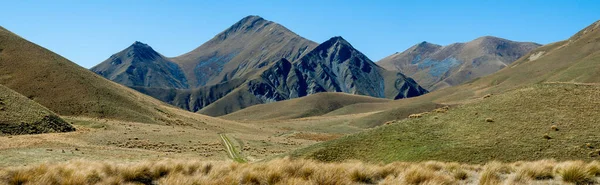 Panoramic mountain view in south island new zealand. Photo taking while driving trough south island.