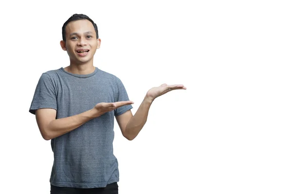 Attractive Asian Man Smiling While Pointing His Open Hand Palm — Stock Photo, Image