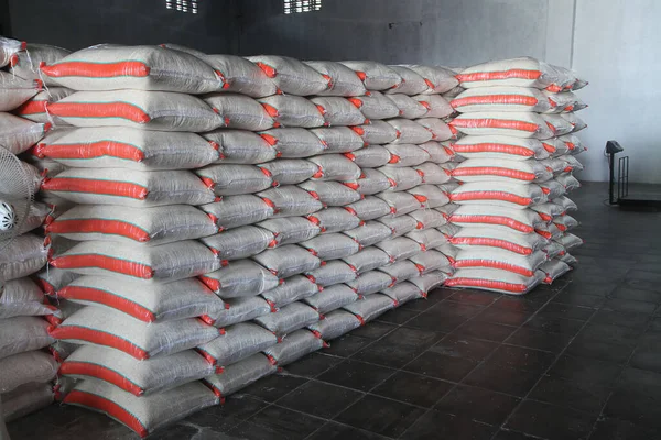 stock image Stack hemp sacks of rice. Pile of rice sacks in grain warehouse