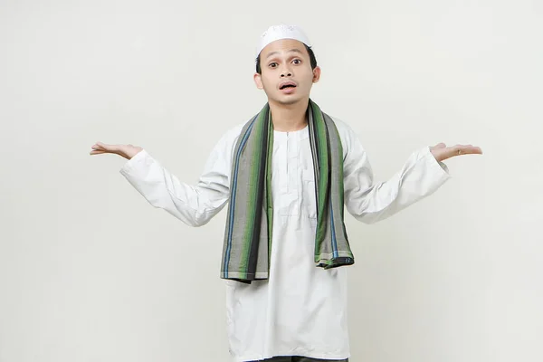 asian muslim man with confused expression. People religious Islam lifestyle concept. celebration Ramadan and ied Mubarak. on isolated backgroun