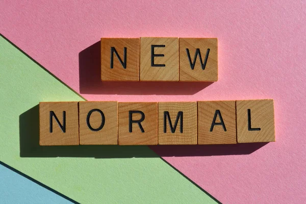 stock image New Normal, words in wooden alphabet letters isolated on colourful background