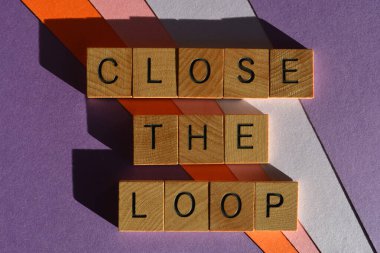 Close The Loop business buzzword phrase meaning to follow up and finish an area of discussion, in wooden alphabet letters isolated on background clipart