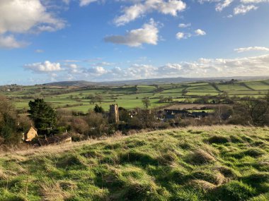 Spring landscape view over the village of East Chinnock to distant green farm fields, Somerset, England