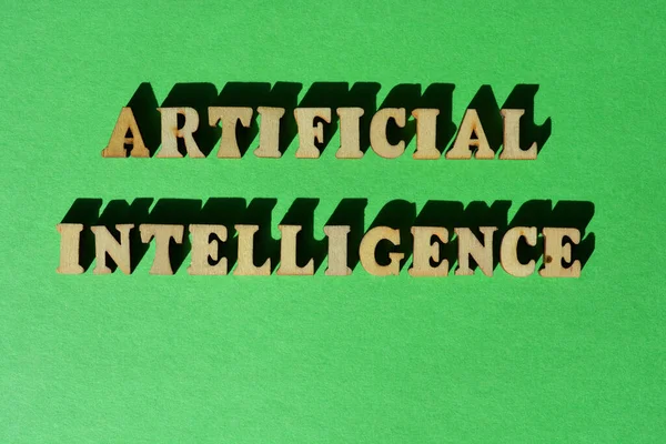 Artificial Intelligence, words in wooden alphabet letters isolated on bright green background