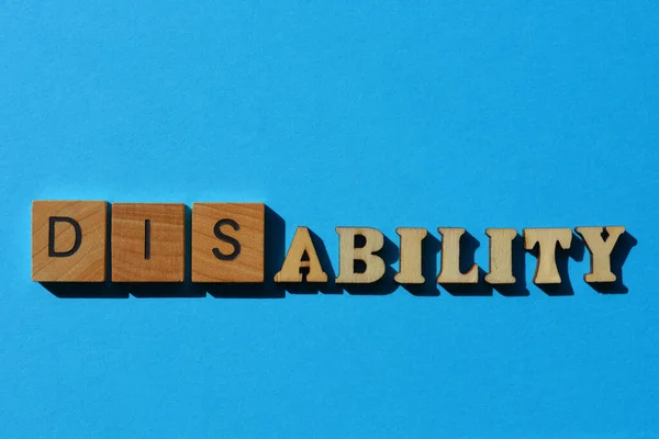 Niepełnosprawność Umiejętność Słowo Drewnianych Liter Alfabetu Izolowane Niebieskim Tle — Zdjęcie stockowe
