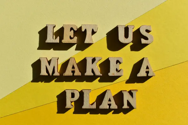 Let Us Make A Plan, words in wooden alphabet letters isolated on yellow background as banner headline