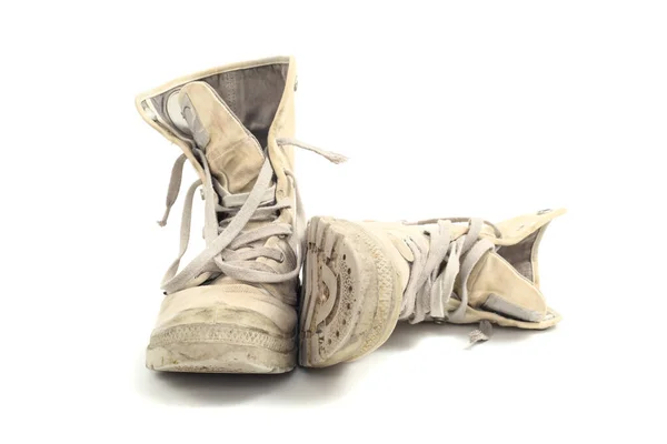 stock image Old canvas boots, isolated over white background