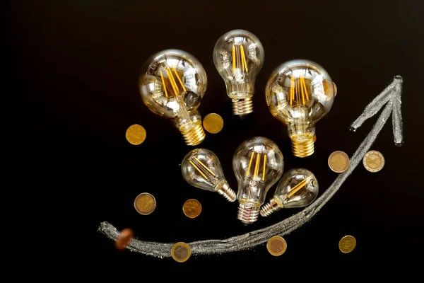 Rising Electricity Prices Light Bulbs Energy Saving Set Arrow Black — Stock Photo, Image
