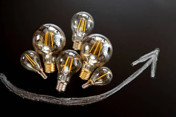 Электричество Cost Rising Электроэнергии Prices Light Лампочки Энергосбережения Настройки Стрелки — стоковое фото