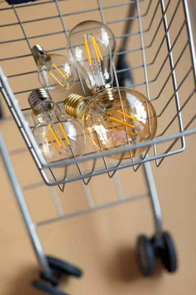 Purchase Electricity Lot Electric Lamps Shopping Cart Consumption Payment Energy — Stock Photo, Image