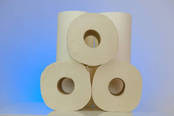 Toilet paper rolls set on a blue background.Purchase and shortage of toilet paper. Cleanliness and health concept. toilet paper shortage. crisis of the paper industry in Europe.