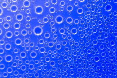 Bubbles background. blue pattern with white circles. Macro round bubbles texture in blue tones.beautiful Indigo background with circles.macro Bubbles set. 