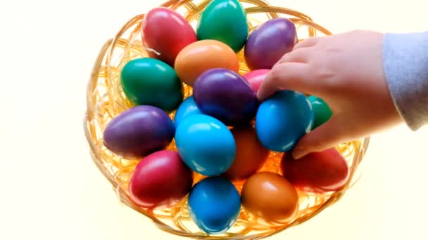 Easter Eggs Childrens Hands Take Colorful Eggs Wicker Basket White — Vídeo de Stock