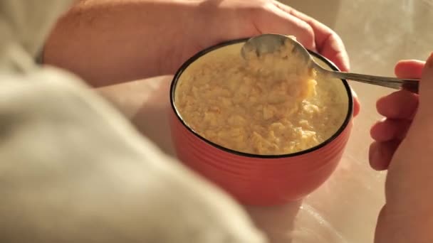Hot Oatmeal Porridge Steam Breakfast Useful Breakfast Man Stirring Hot — Stockvideo
