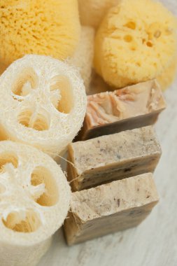  Hygiene products set.reasonable consumption. Natural cognac sponges and loofah washcloths on a wooden white shabby board.Hygiene and health concept.Eco friendly bio natural cosmetics. 