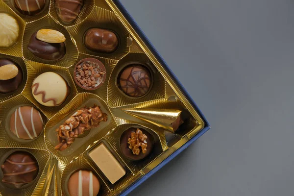Assorted chocolate candies in a box. Chocolate box. Milk chocolate candy.Sweets and desserts.Sweets box in assortment