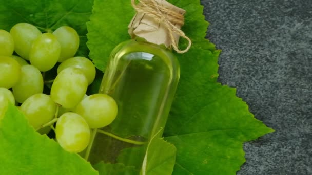 Grape Seed Oil Grapes Leaves Oil Transparent Bottle Black Slate — Wideo stockowe