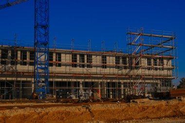  scaffolding.Building materials and the process of building a new house.Home construction.Construction of real estate and industrial premises concept.