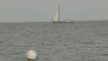old sailboat sails on the sea.Cruise. Vacation at sea.slow motion. High quality 4k footage