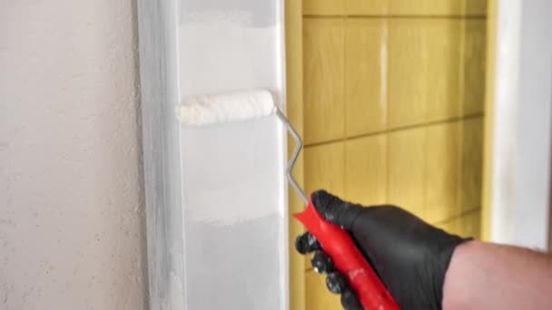 Door Painting Man Paints Wooden Door White Roller Redecorating Home — Vídeo de Stock