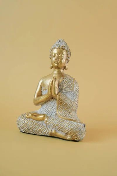 Buddha golden statue .Beautiful meditation and harmony background in golden colors. Meditation and relaxation symbol.Calm, balance and harmony.