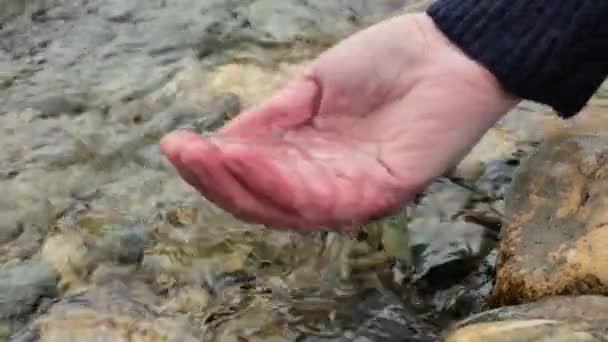 Clean Water Pours Drips Open Palm Splashes Drops Hand Touches — Stock Video
