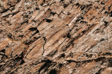 Taş zemin. Kaya tabakası dokusu. Kahverengi tonlarda doğal taş dokusu. 