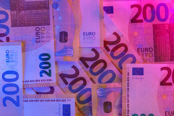 Money Colored Background Two Hundred Euro Bills Close Purple Neon — Stock Photo, Image