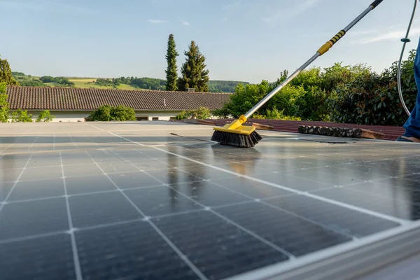 washing solar panels from dust and dirt .Solar Panel Efficiency.Cleaning solar panels. solar power technology.renewable energy.Alternative natural energy sources