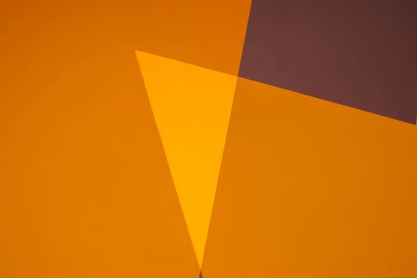 paper geometric background in brown, orange colors.geometric pattern. Color blocking background. broken lines background in warm colors. Wallpaper graphic.