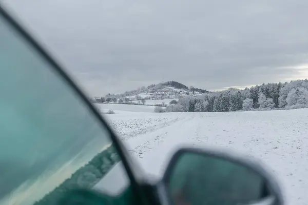 Road traffic in winter.stopped car on a winter snowy road under a gray snowy sky.Winter beautiful landscape and car. traffic in winter season