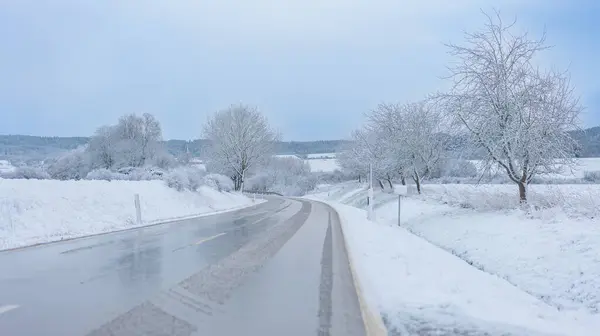 stock image  Slippery winter road.Trees in the snow along the road. Road traffic in winter.Winter beautiful landscape.Danger of roads in winter 