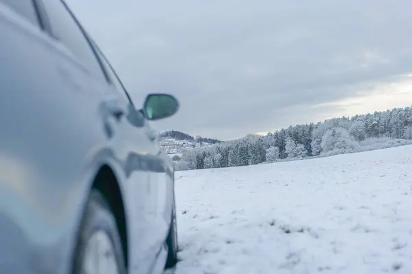Slippery road.stopped car under a gray snowy sky.Road traffic in winter.Winter beautiful landscape and car. traffic in winter season