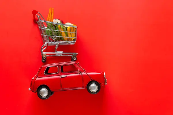 Delivery Products Red Car Shopping Basket Fruits Vegetables Red Background —  Fotos de Stock
